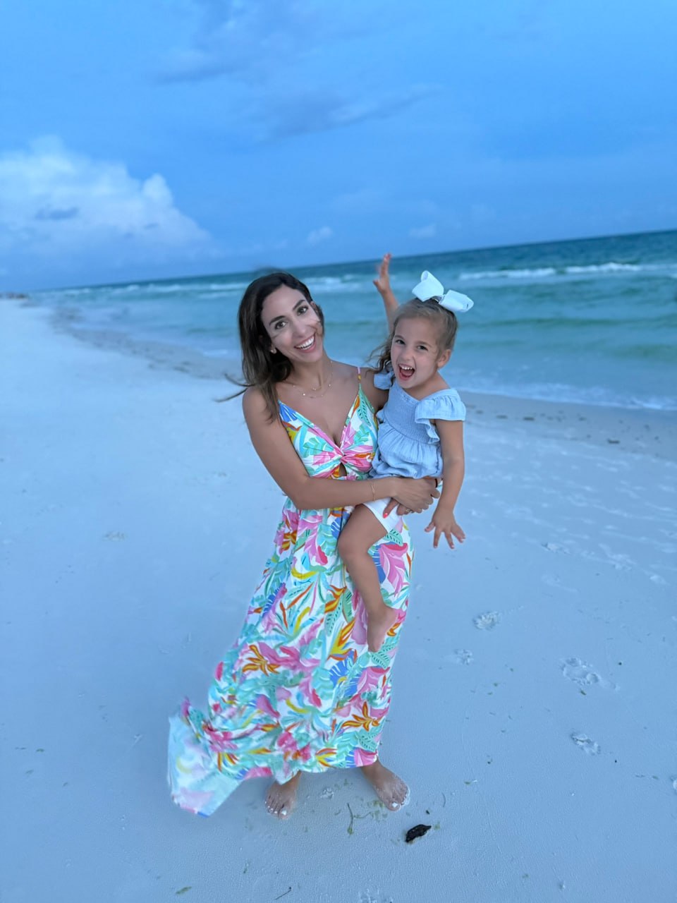 Liana and her daughter on the beach